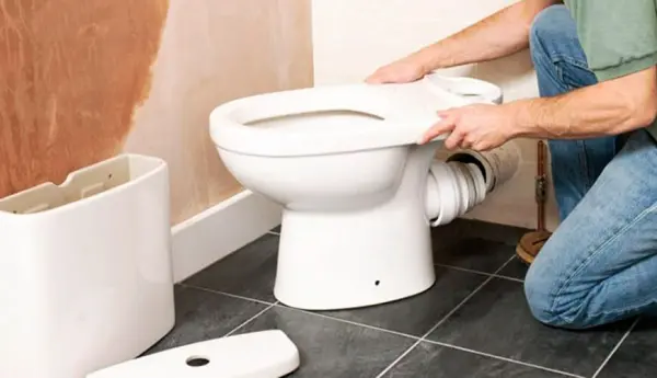 Removing the old toilet before replacement
