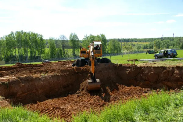 Site preparation for foundation and soil development with an excavator