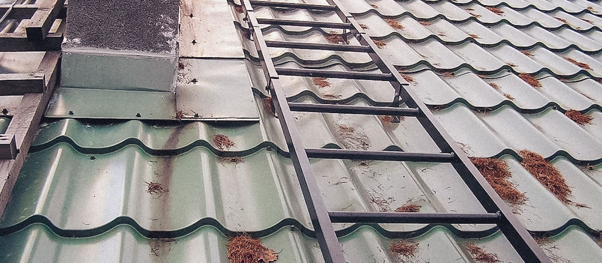 Corrosion at metal roofing damage points